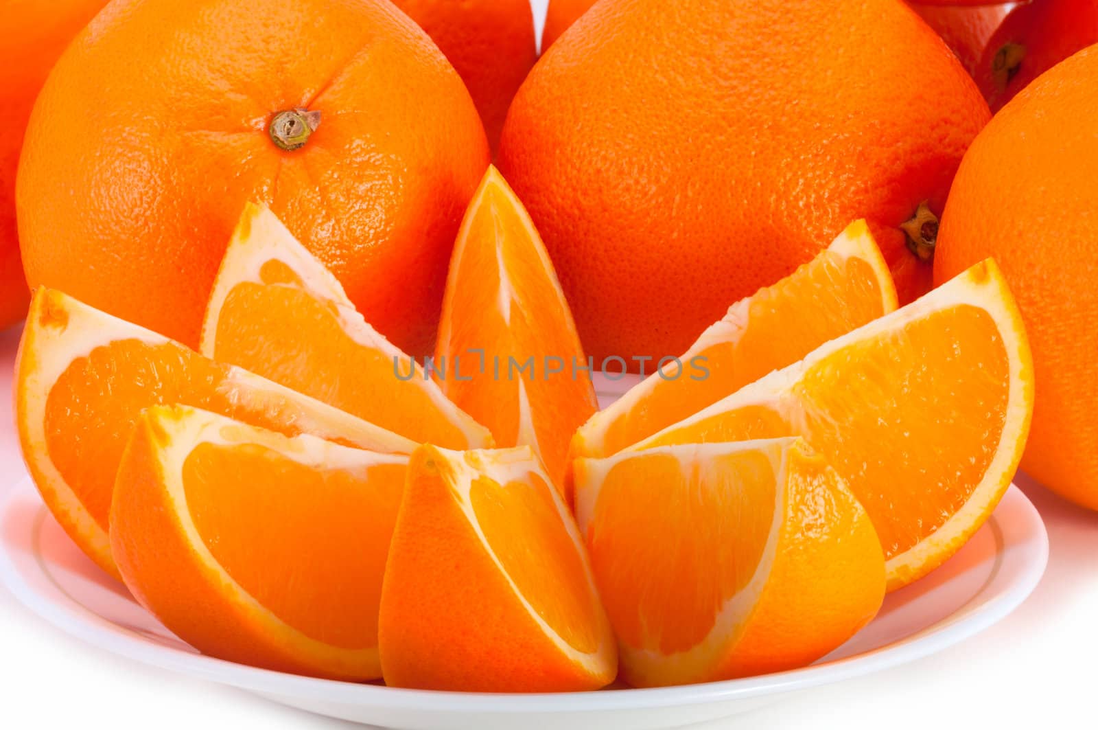 Vivid fresh oranges on the table. by lobzik