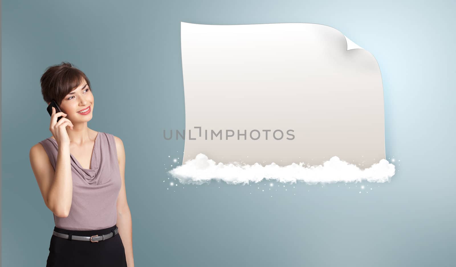 pretty young woman making phone call and presenting modern copy space on clouds