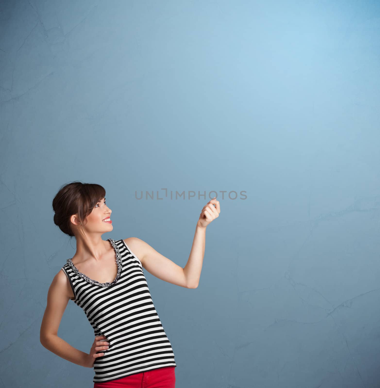 Pretty young lady gesturing with copy space