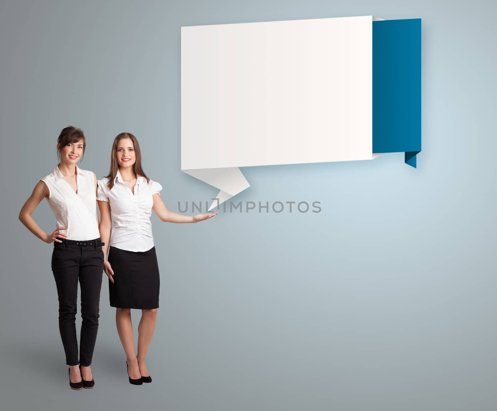 attractive young women presenting modern origami copy space