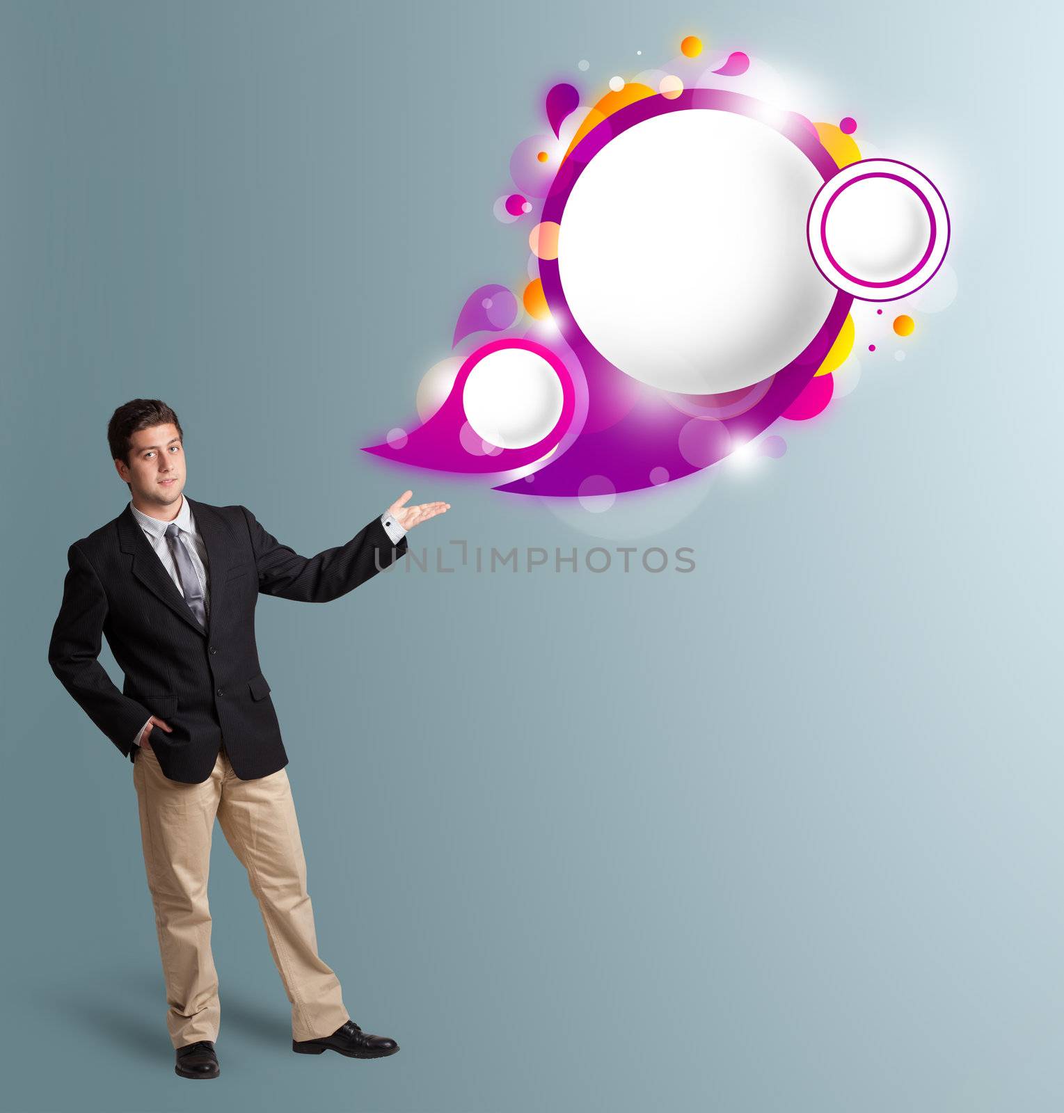 Handsome man presenting abstract speech bubble copy space by ra2studio
