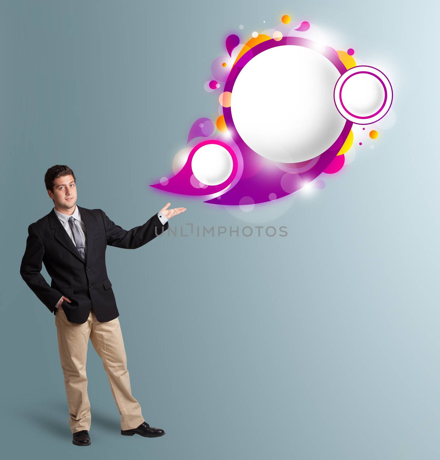 Handsome young man presenting abstract speech bubble copy space