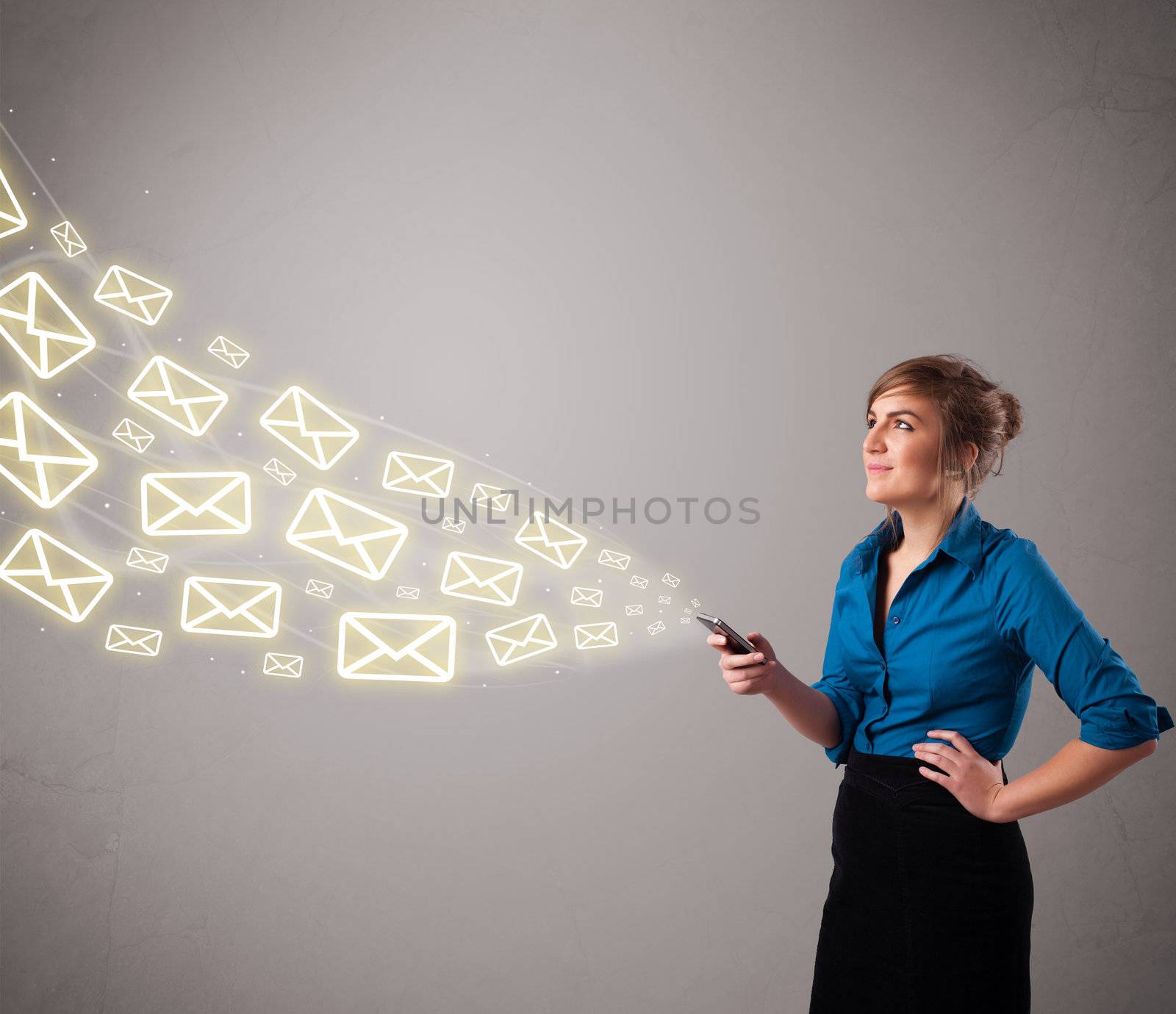 attractive young lady standing and holding a phone with message icons