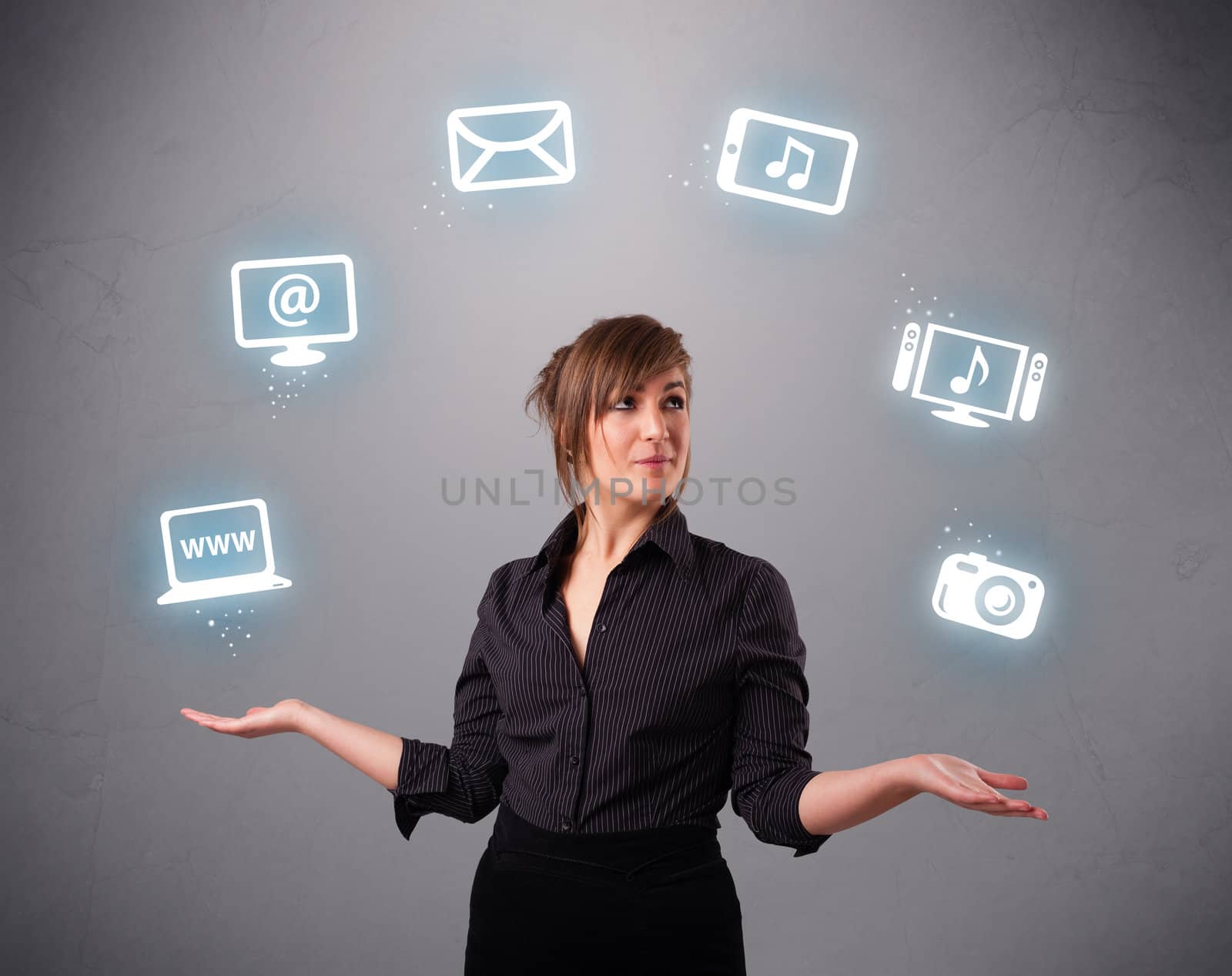 pretty girl standing and juggling with elecrtonic devices icons