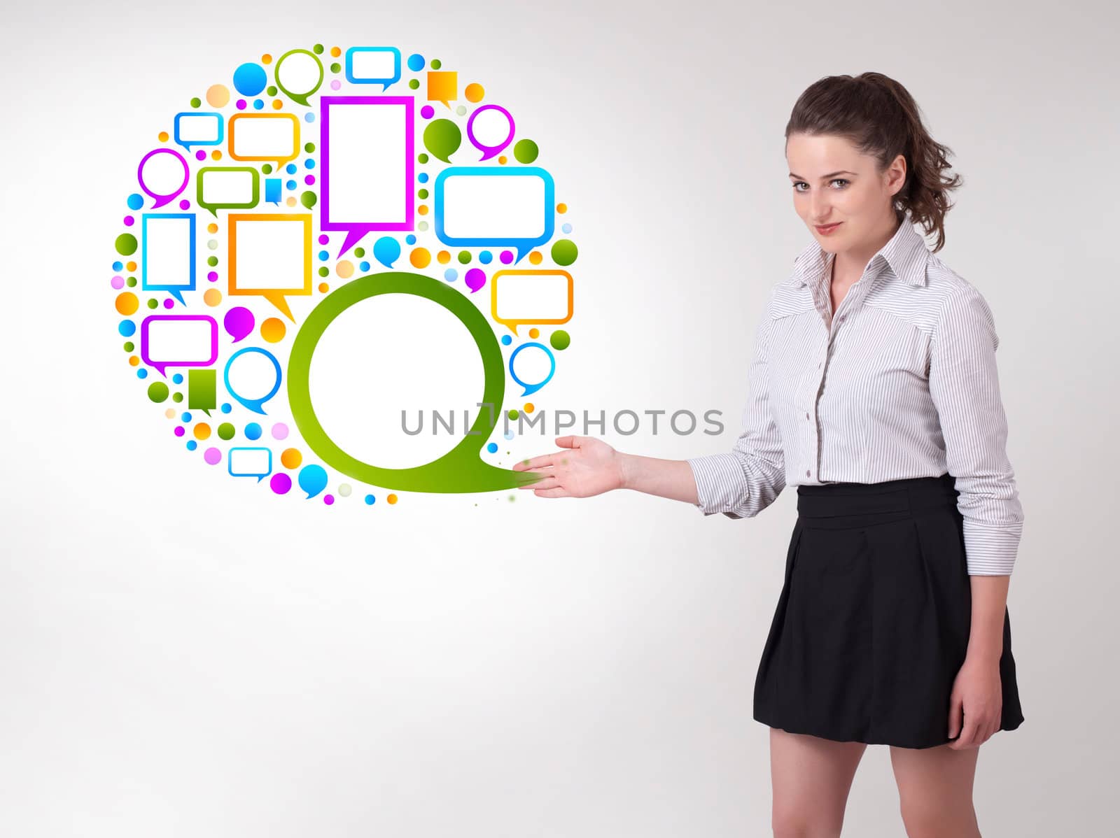 Young business woman presenting colourful speach bubble on bright background