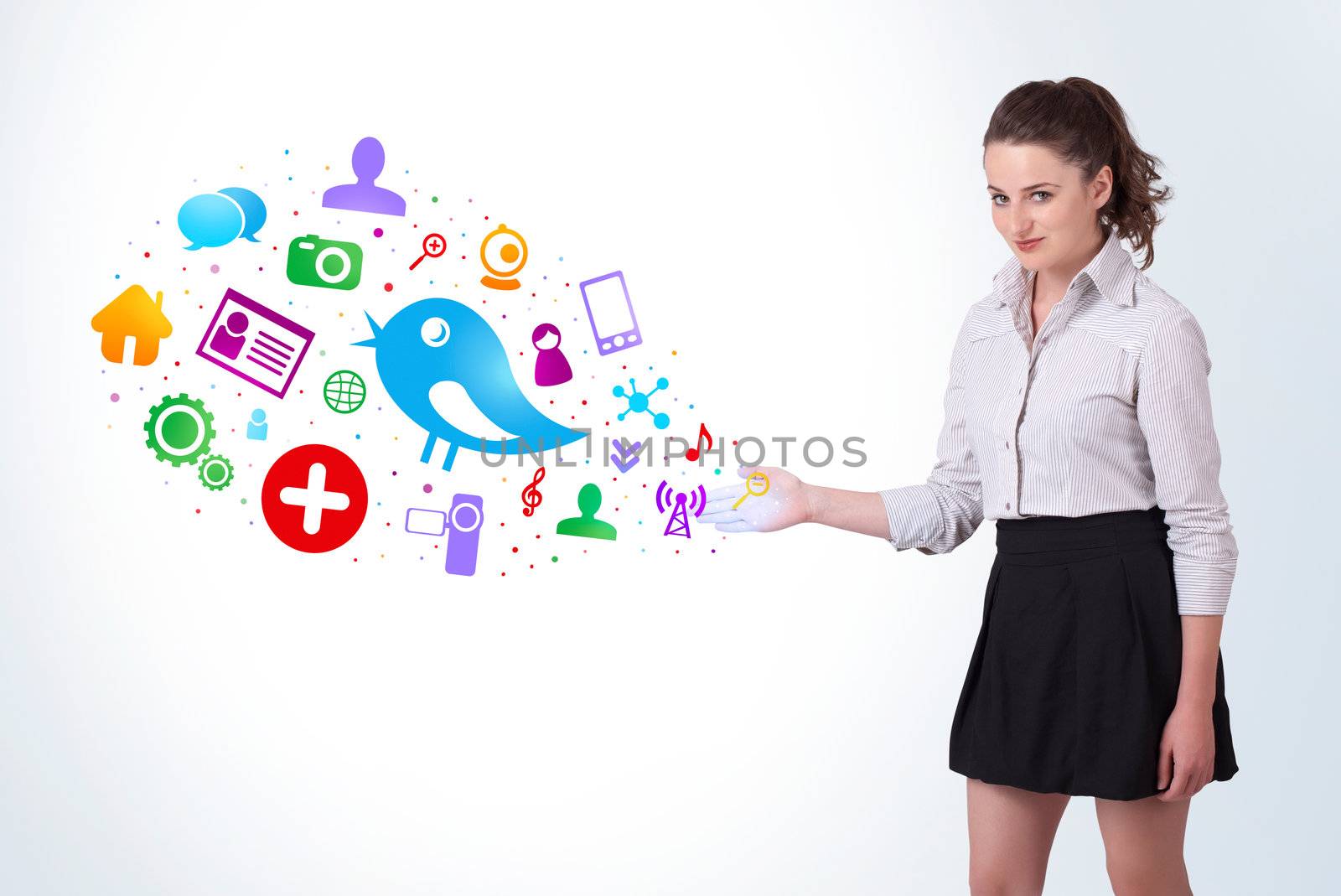 Young business woman presenting colourful social icons on bright background