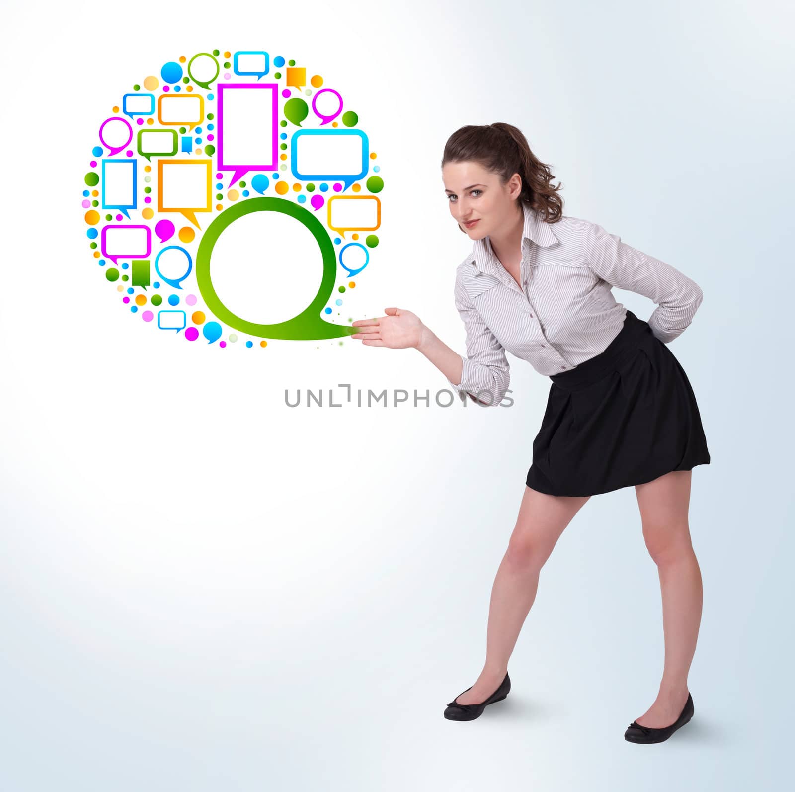 Young business woman presenting colourful speach bubble on bright background