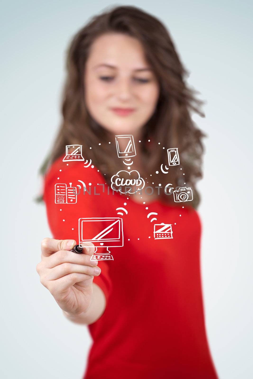 Young woman drawing a cloud computing on white whiteboard