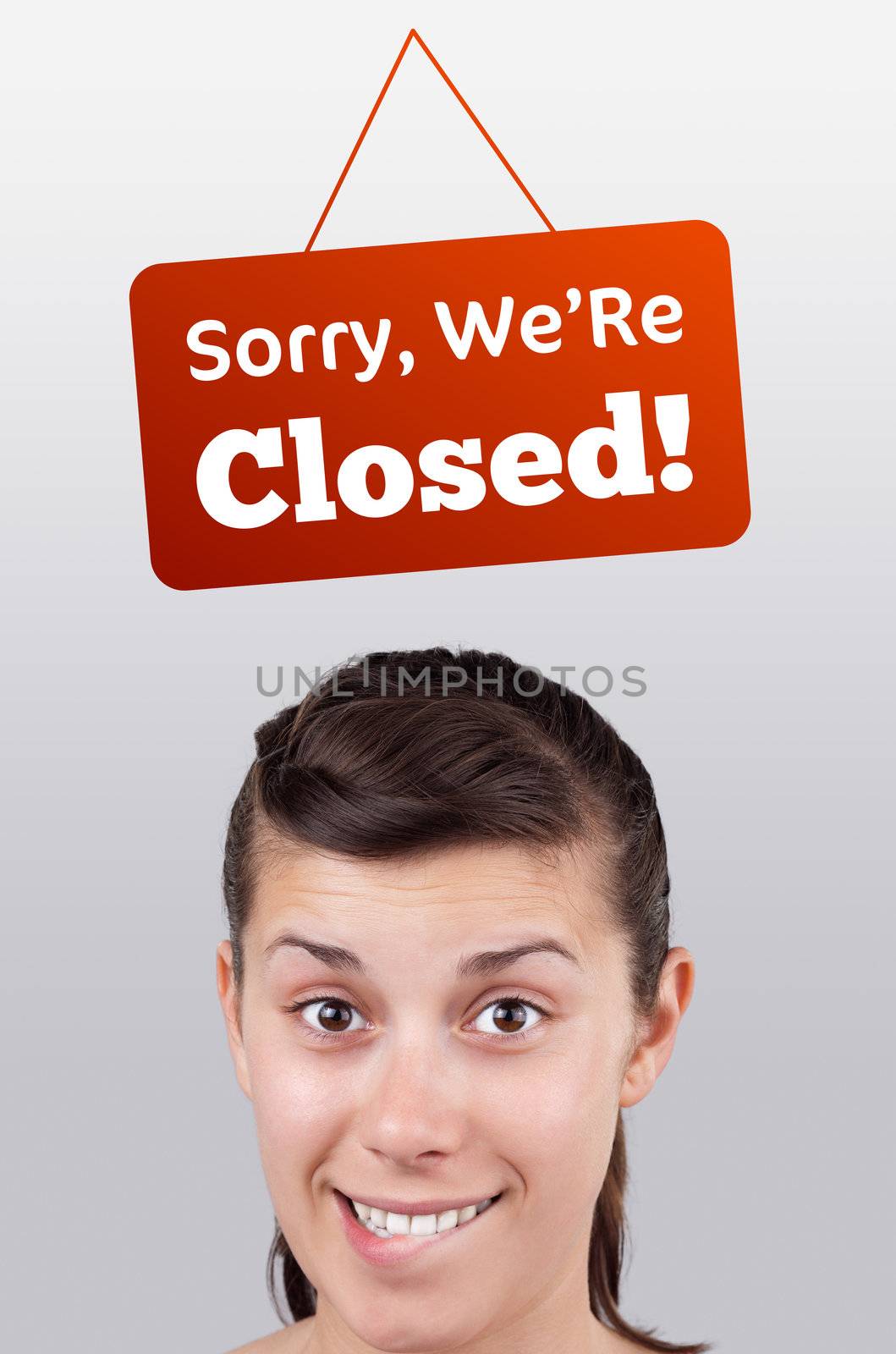 Young girl head looking at closed and open signs