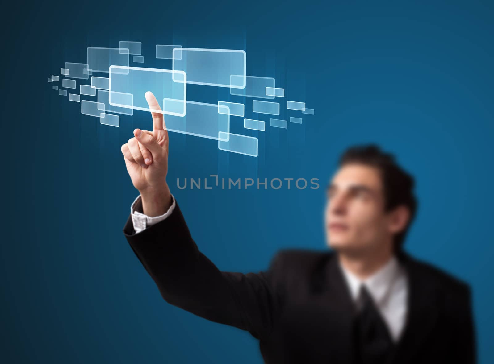 Businessman pressing high tech type of modern buttons on a virtual background