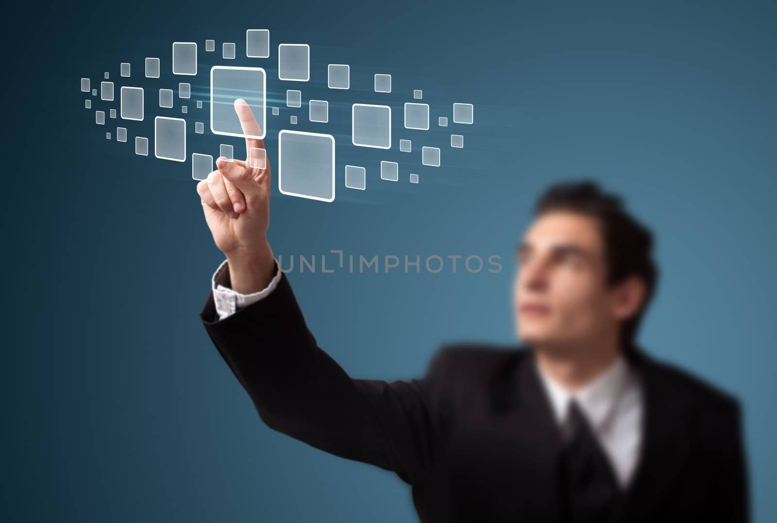 Businessman pressing high tech type of modern buttons on a virtual background