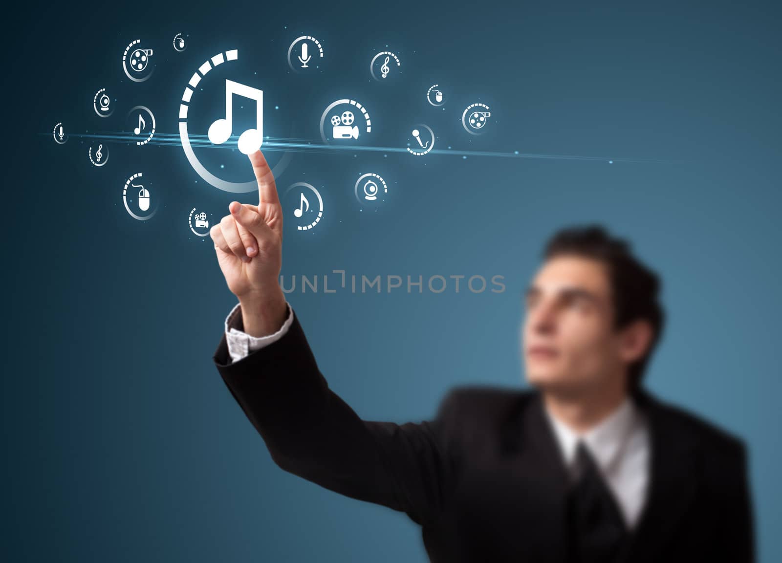 Businessman pressing multimedia type of modern buttons with virtual background