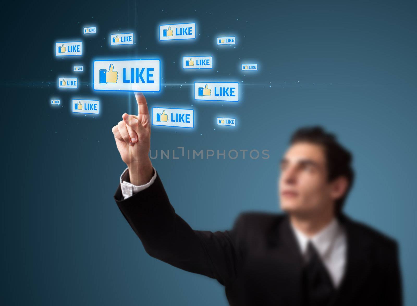 Businessman pressing modern social buttons on a virtual background