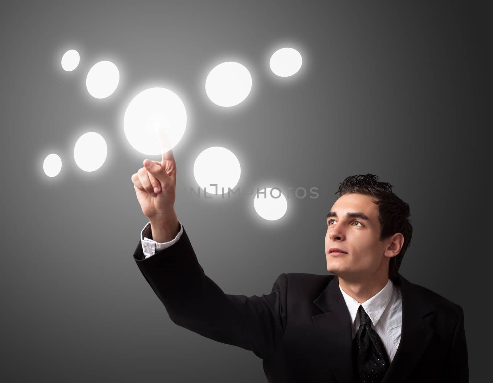 business man pressing a touchscreen button 