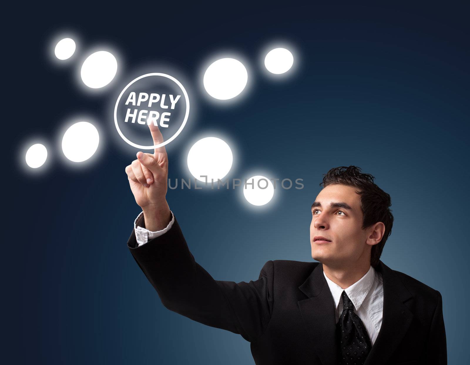 Business man pressing a "Apply HERE" button. 