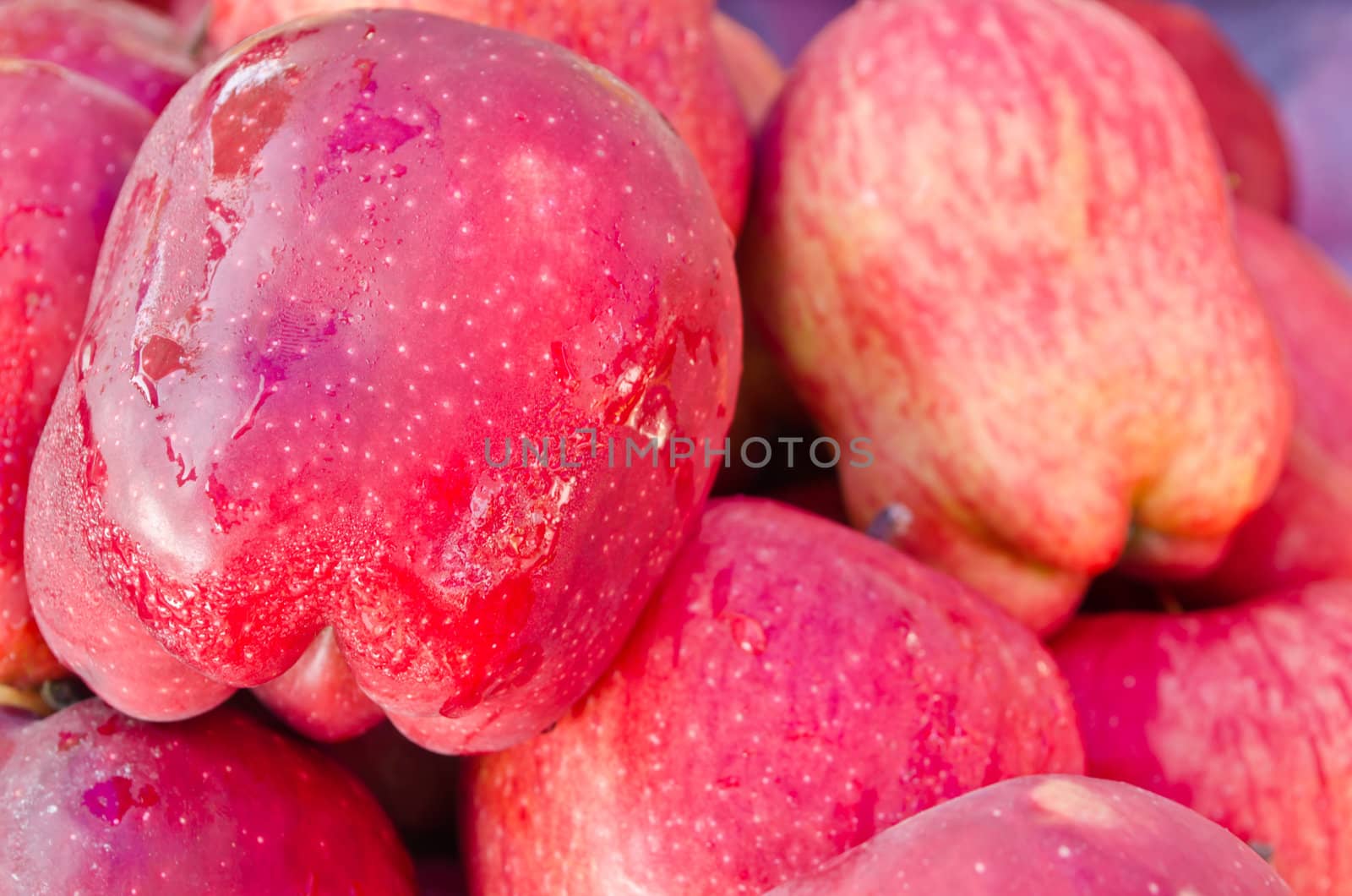 Crunchy red apples closeup, natural background
