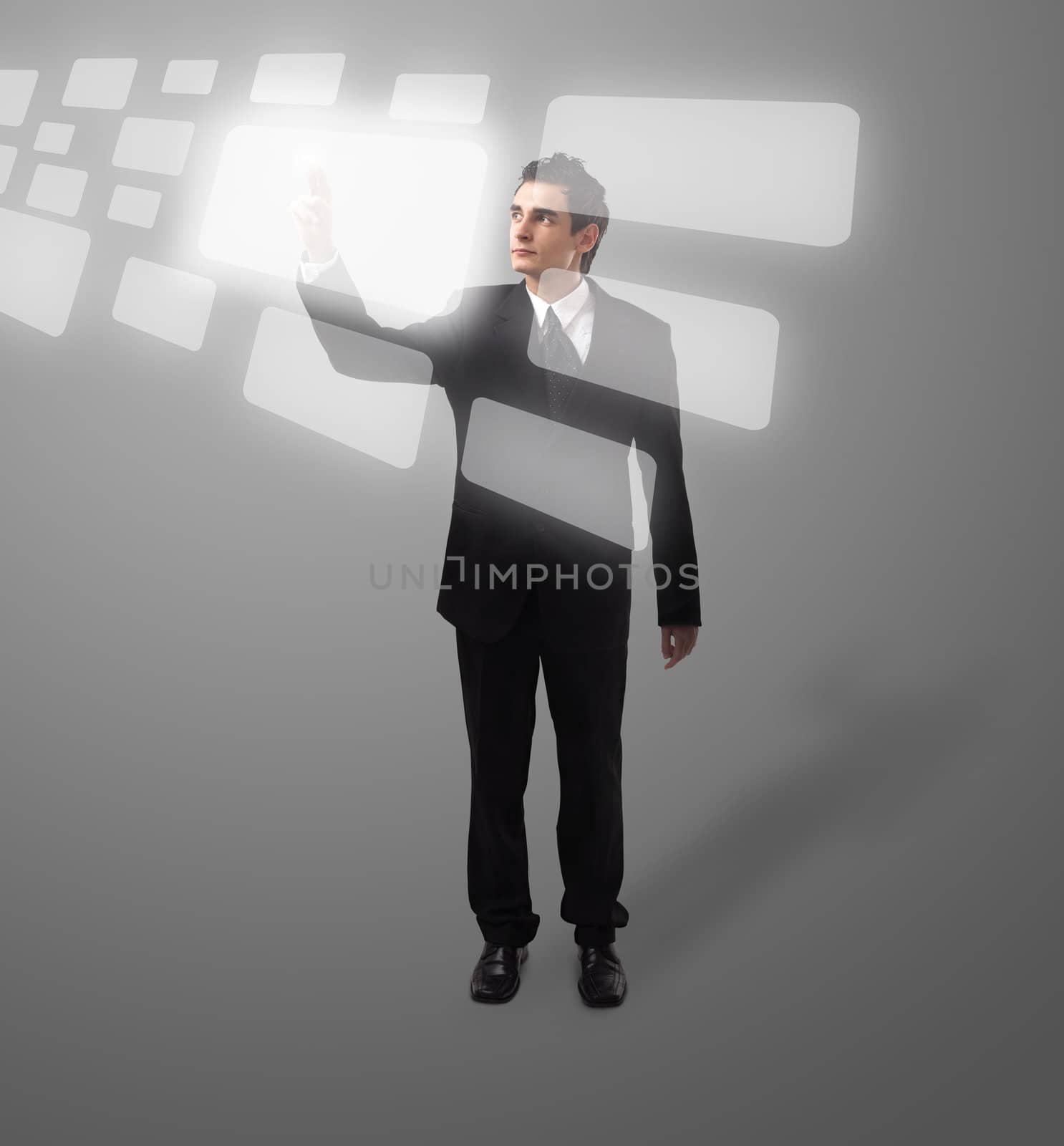 Business man pressing a touchscreen button, futuristic digital technology