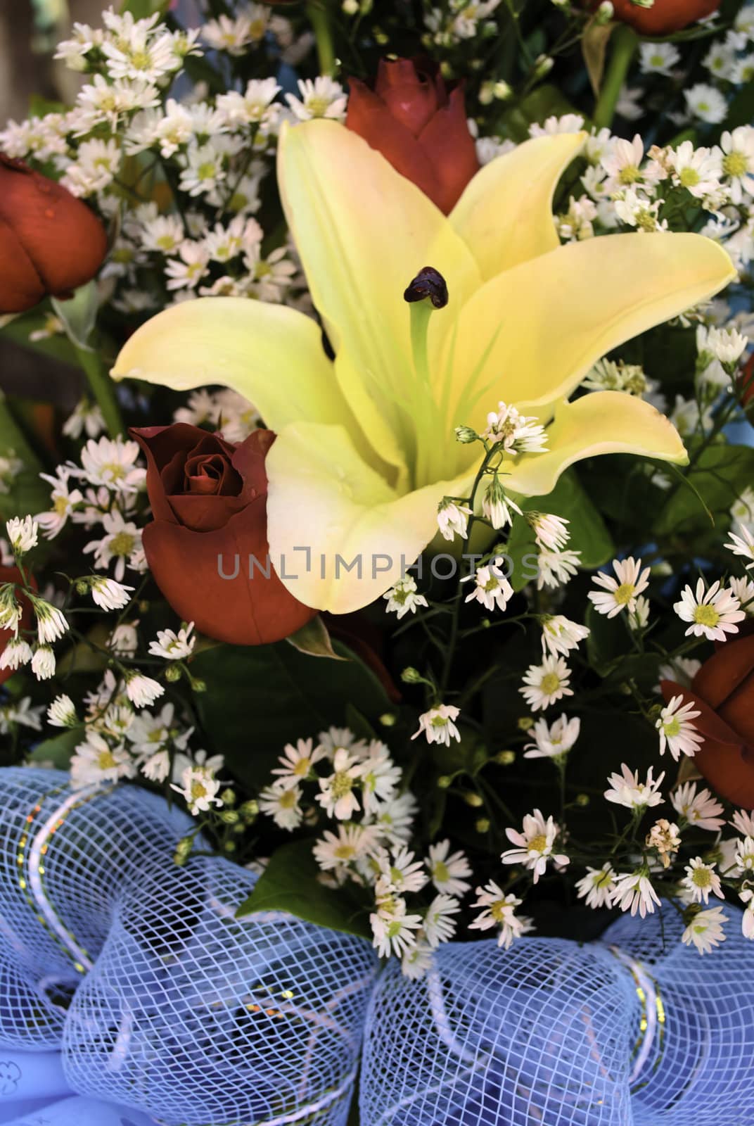 colorful spring flowers bouquet. red roses