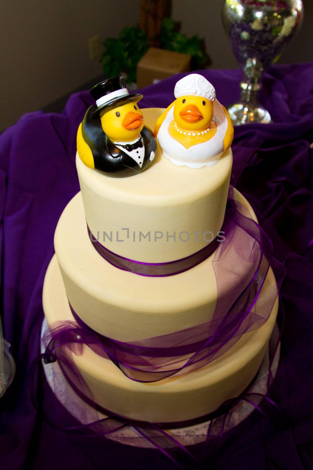 Rubber ducks are the cake toppers for this wedding cake at a very non-traditional reception for the bride and groom.