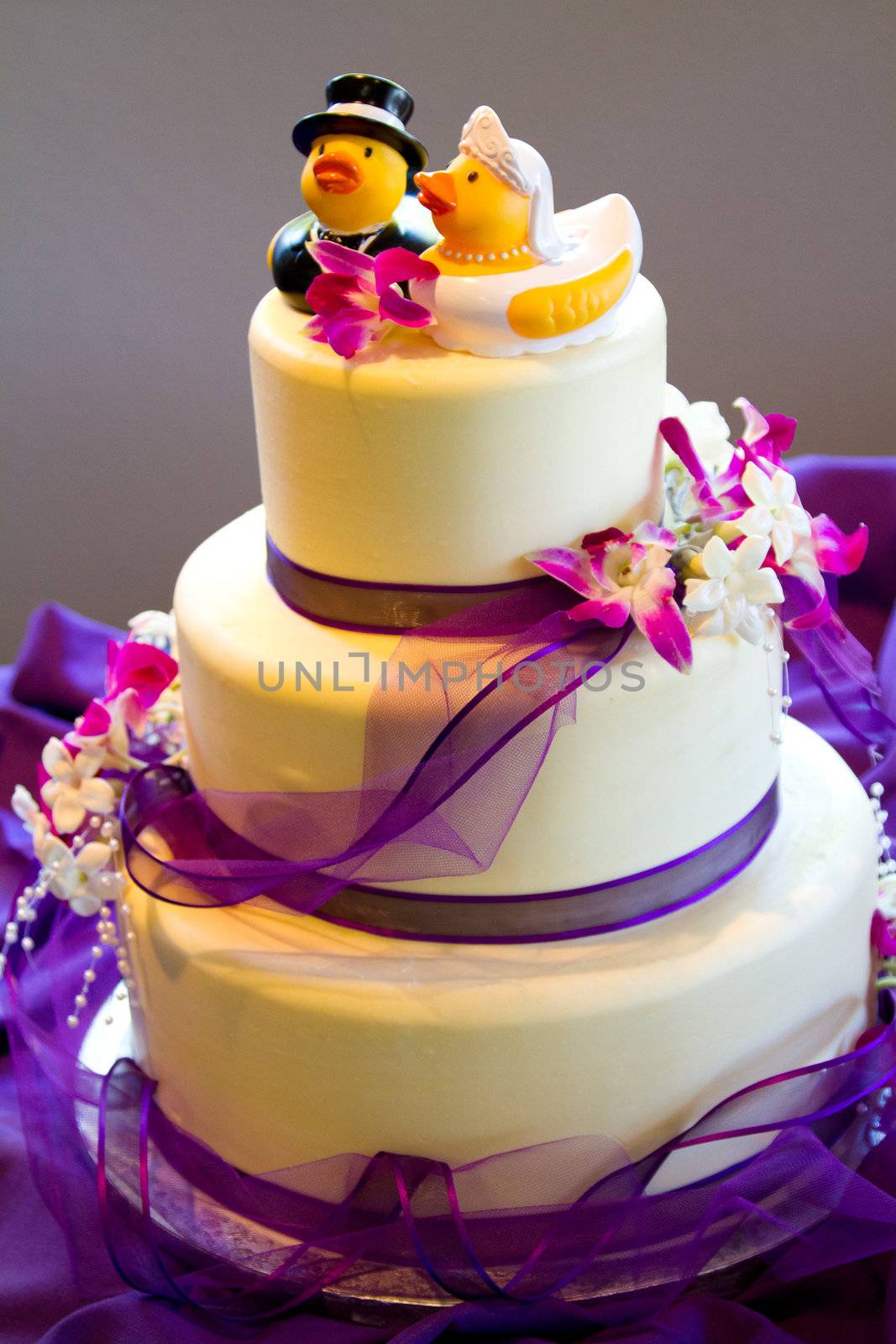 Rubber ducks are the cake toppers for this wedding cake at a very non-traditional reception for the bride and groom.