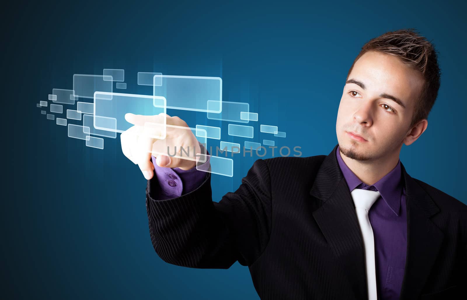 Businessman pressing high tech type of modern buttons on a virtual background