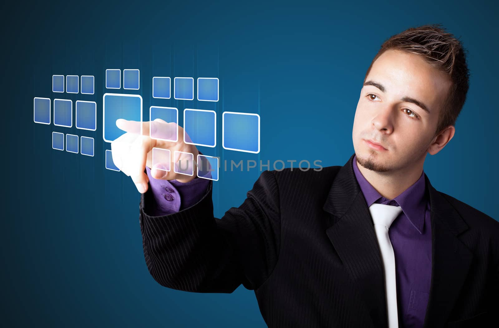 Businessman pressing high tech type of modern buttons on a virtual background