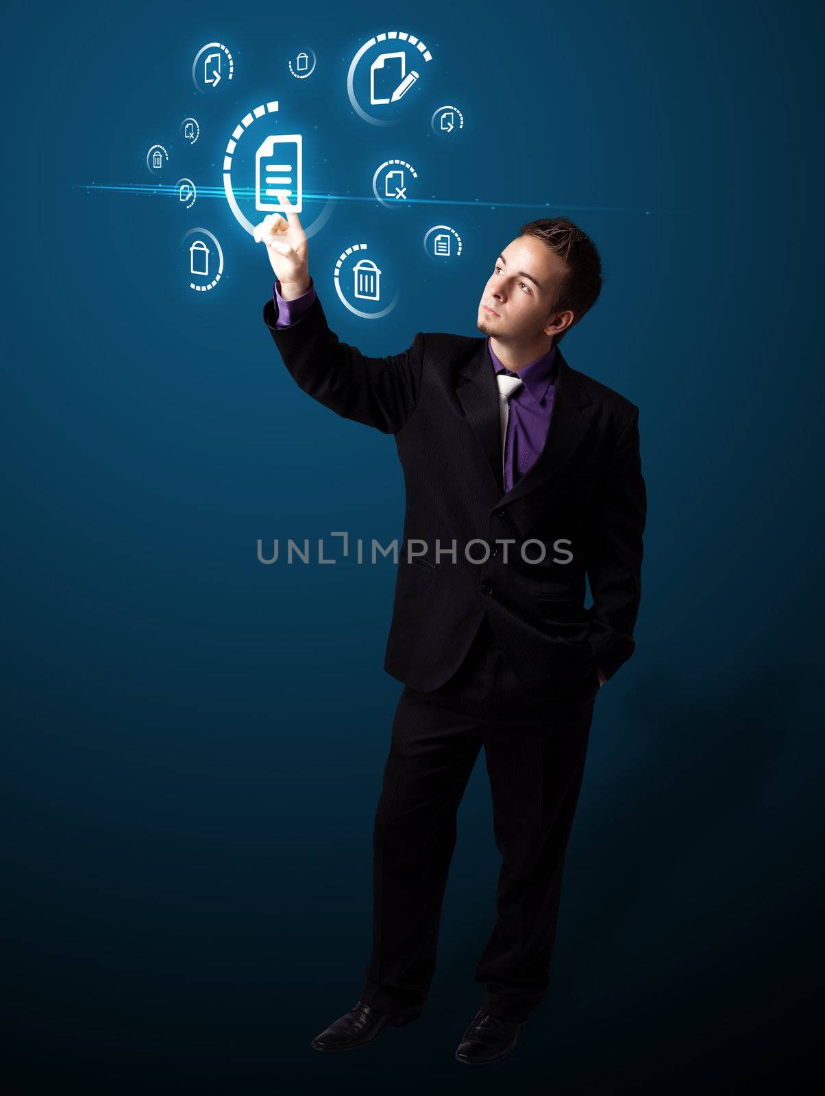 Businessman pressing virtual messaging type of icons by ra2studio