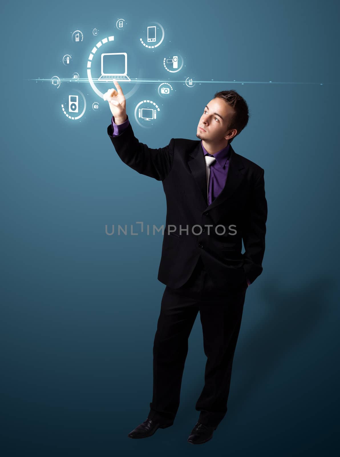 Businessman pressing multimedia type of modern buttons with virtual background