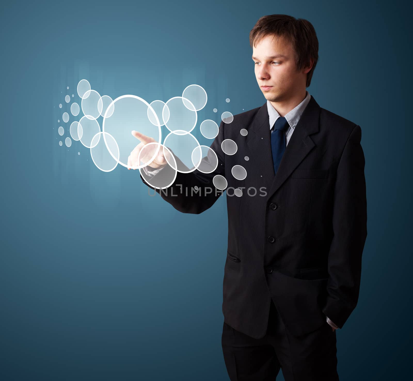 Businessman pressing high tech type of modern buttons on a virtual background