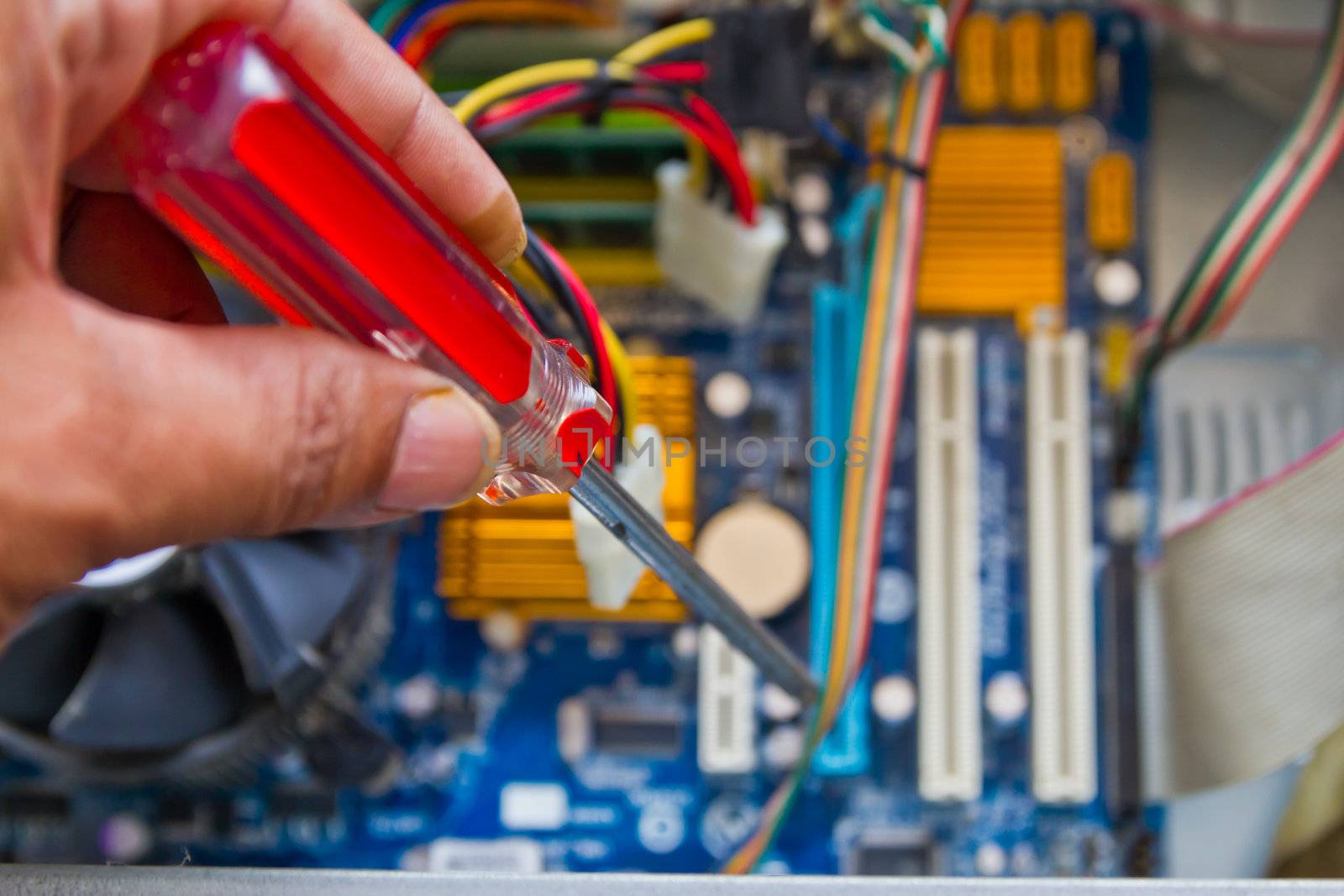 Technician repairing computer hardware in the lab