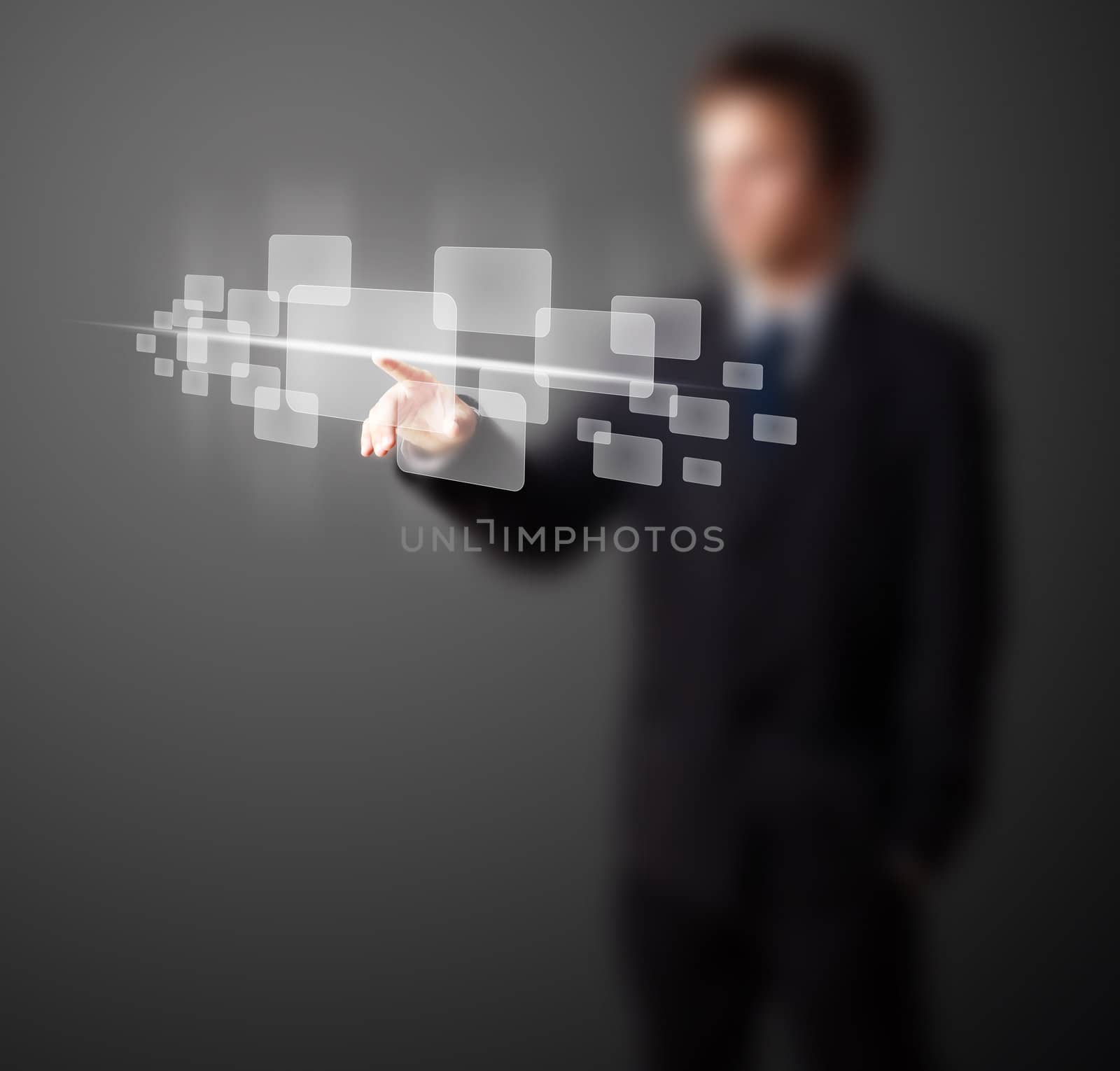 Businessman pressing high tech type of modern buttons on a virtual background