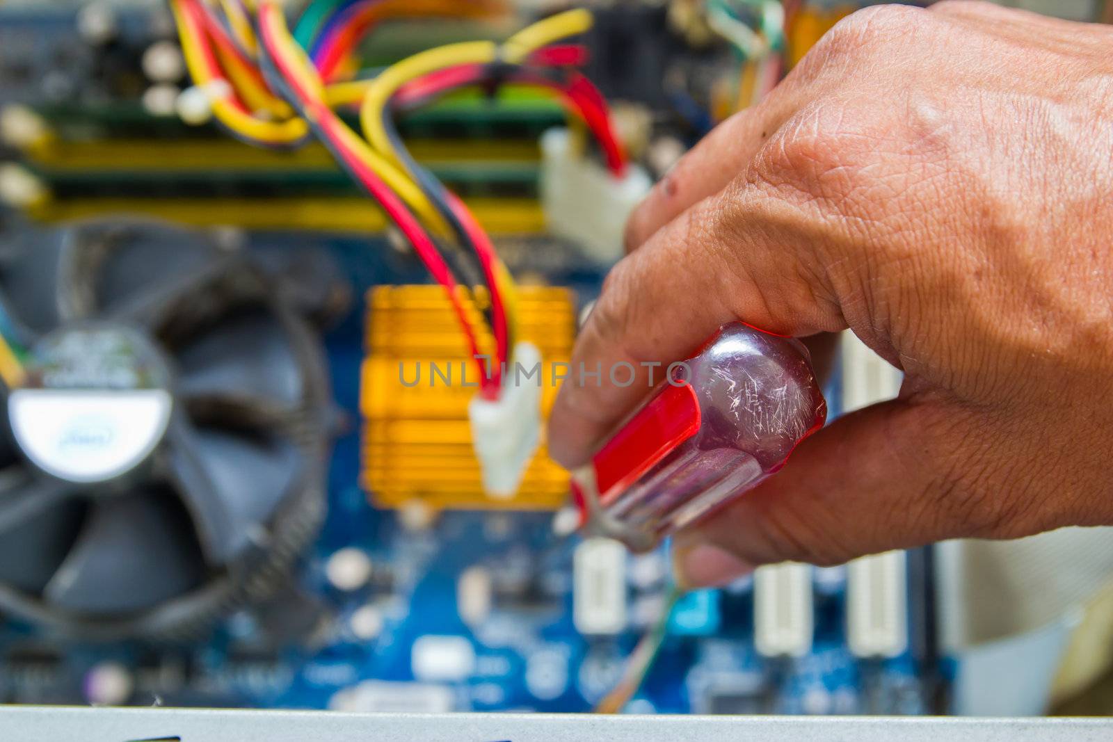 Technician repairing computer hardware in the lab by wasan_gredpree