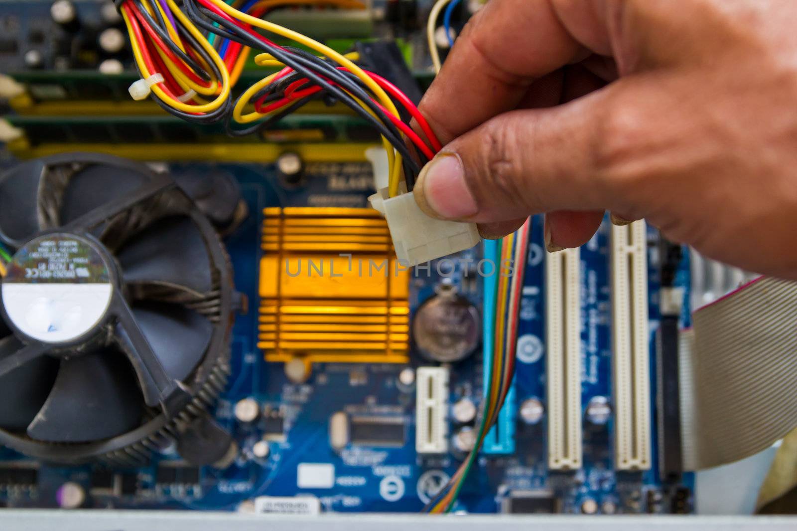 Technician repairing computer hardware in the lab