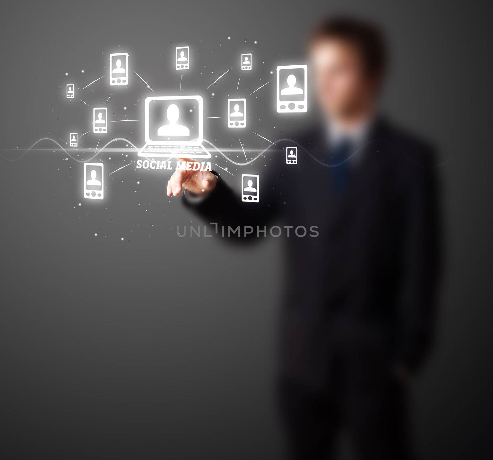 Businessman pressing modern social buttons on a virtual background