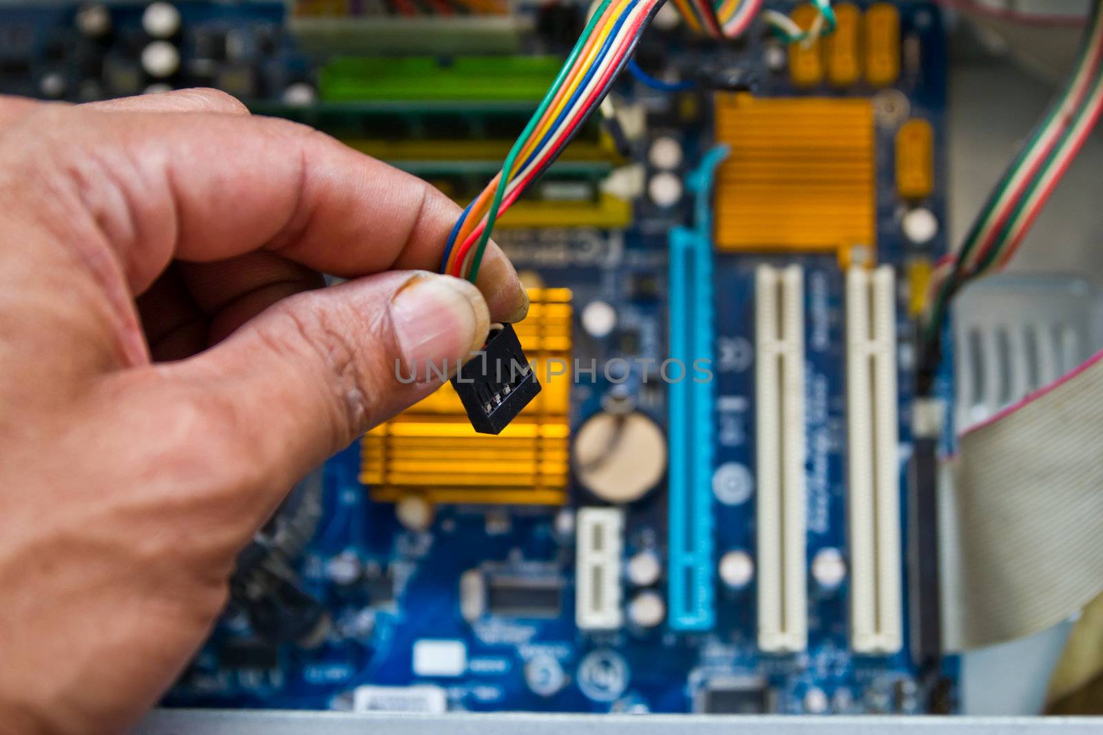 Technician repairing computer hardware in the lab