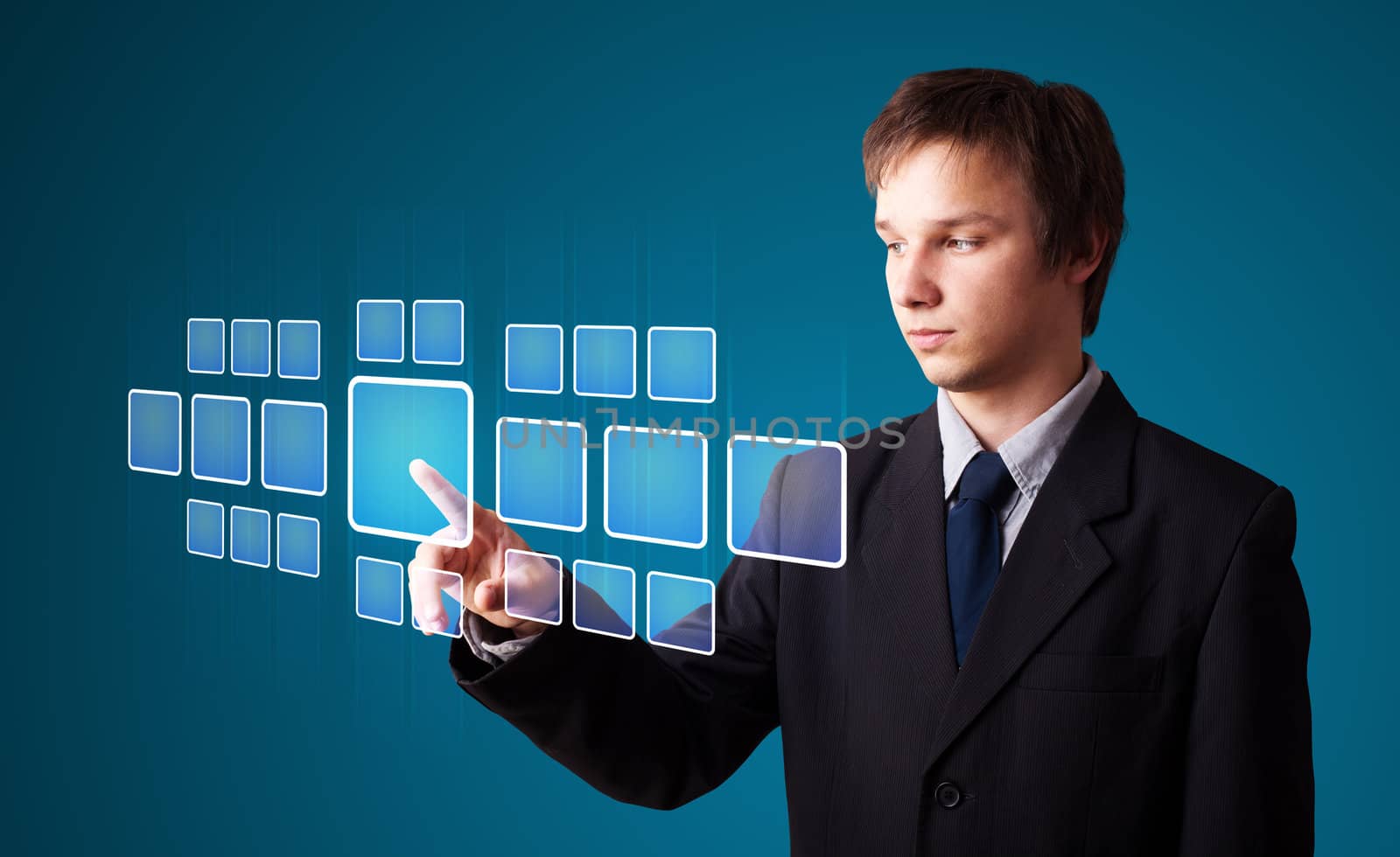 Businessman pressing high tech type of modern buttons on a virtual background