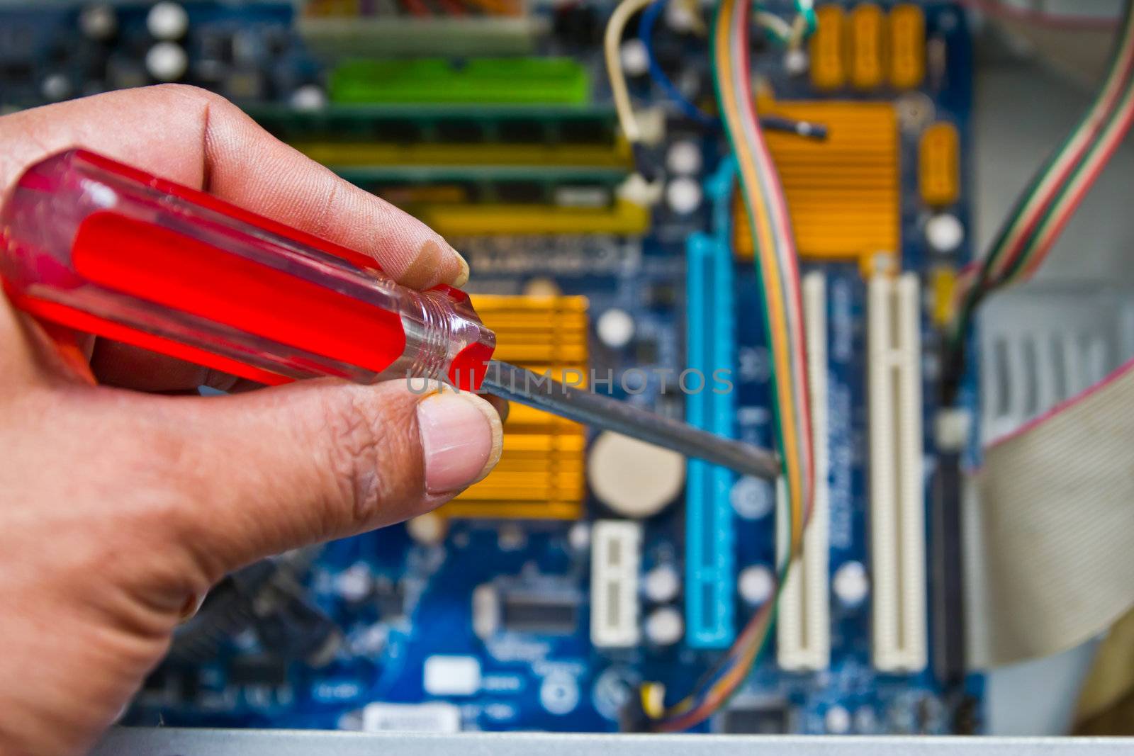 Technician repairing computer hardware in the lab by wasan_gredpree