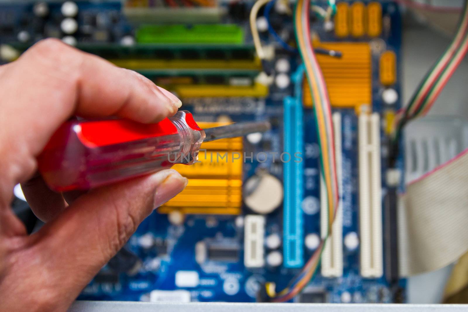 Technician repairing computer hardware in the lab