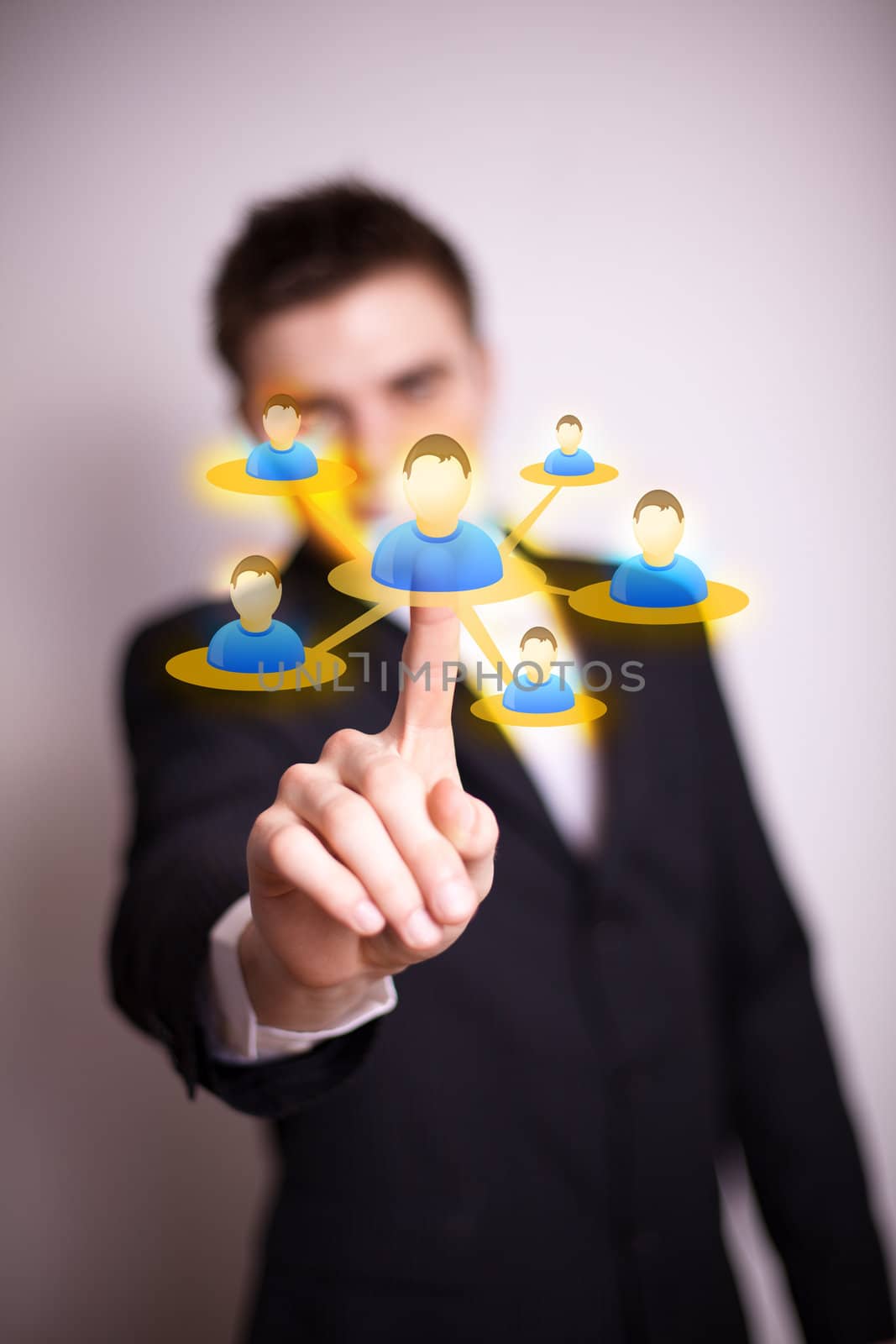Businessman  hand pressing Social network icon 