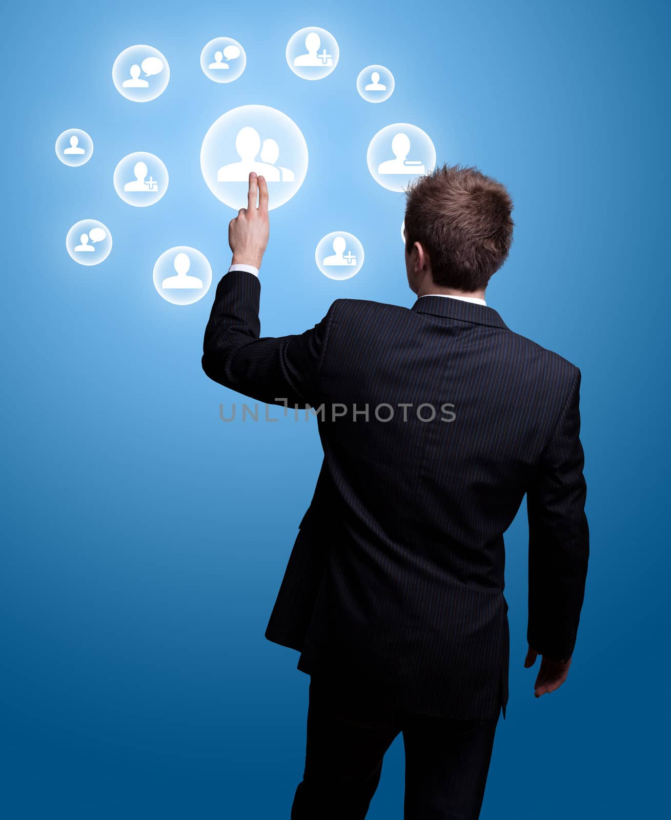 Businessman hand pressing Social network icon