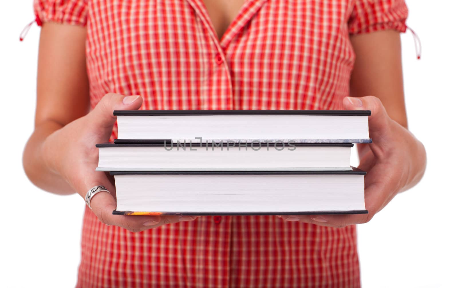 Young schoolgirl holding books by ra2studio