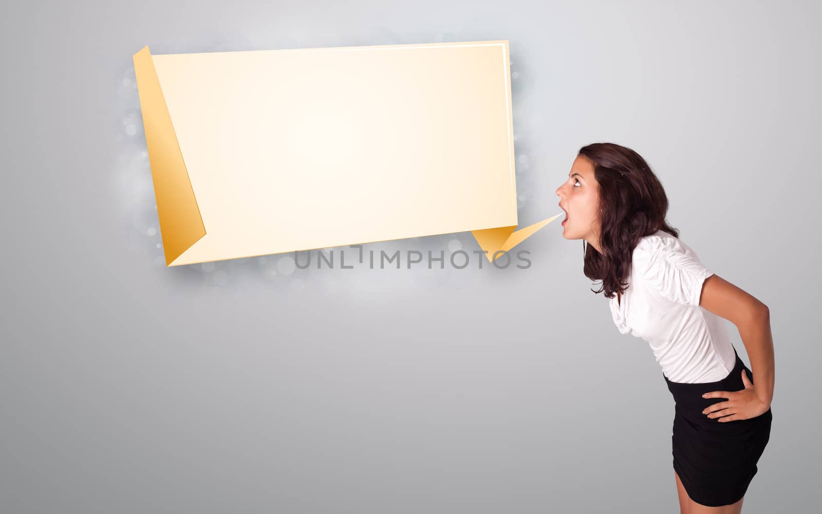 attractive young woman gesturing with modern origami copy space