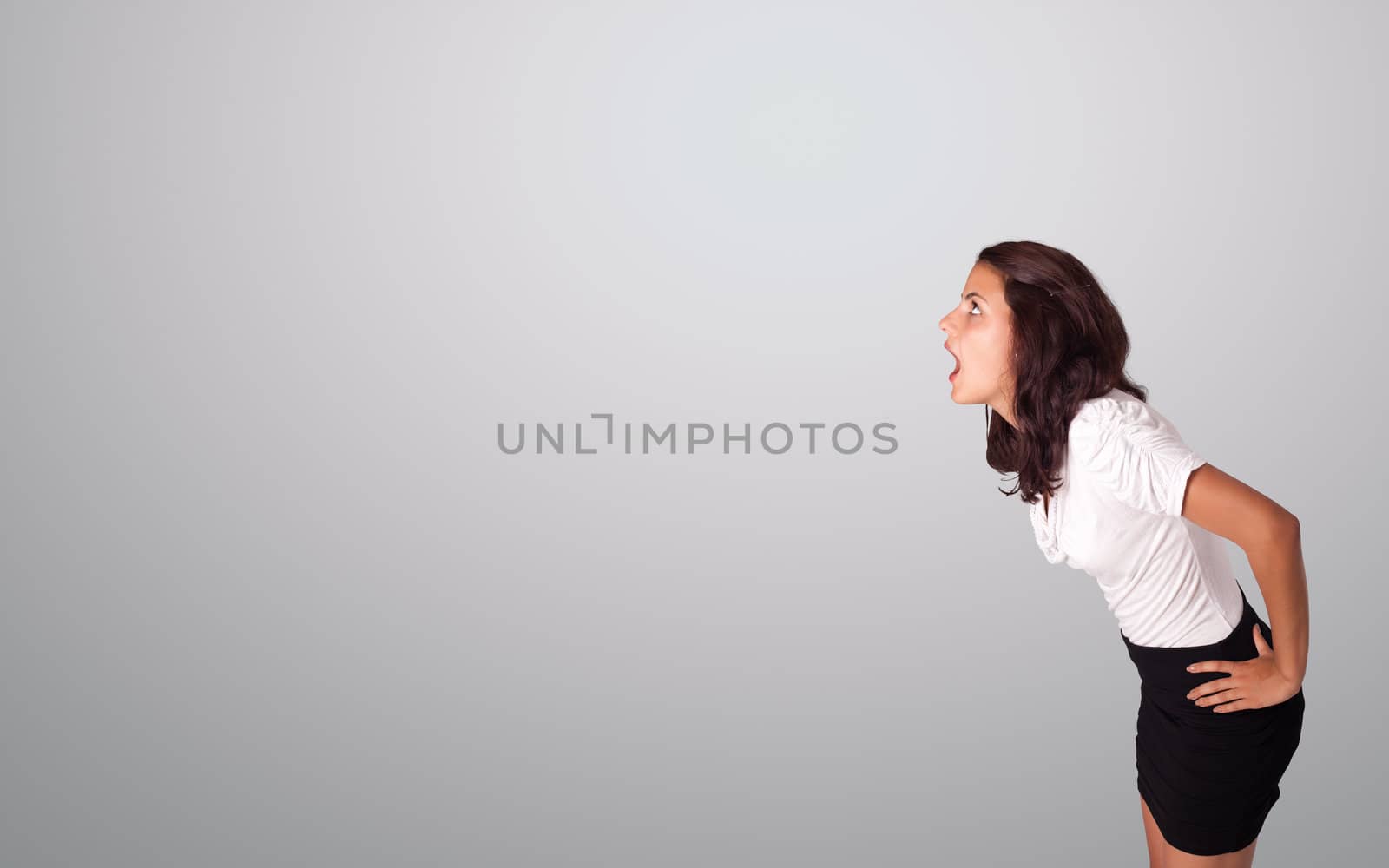 pretty woman gesturing with copy space by ra2studio