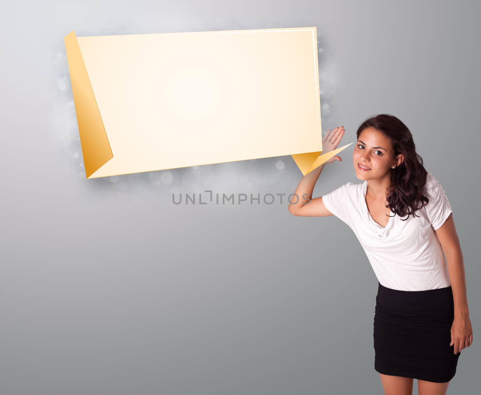 attractive young woman gesturing with modern origami copy space