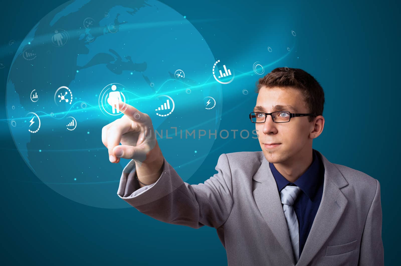 Businessman pressing modern social buttons on a virtual background