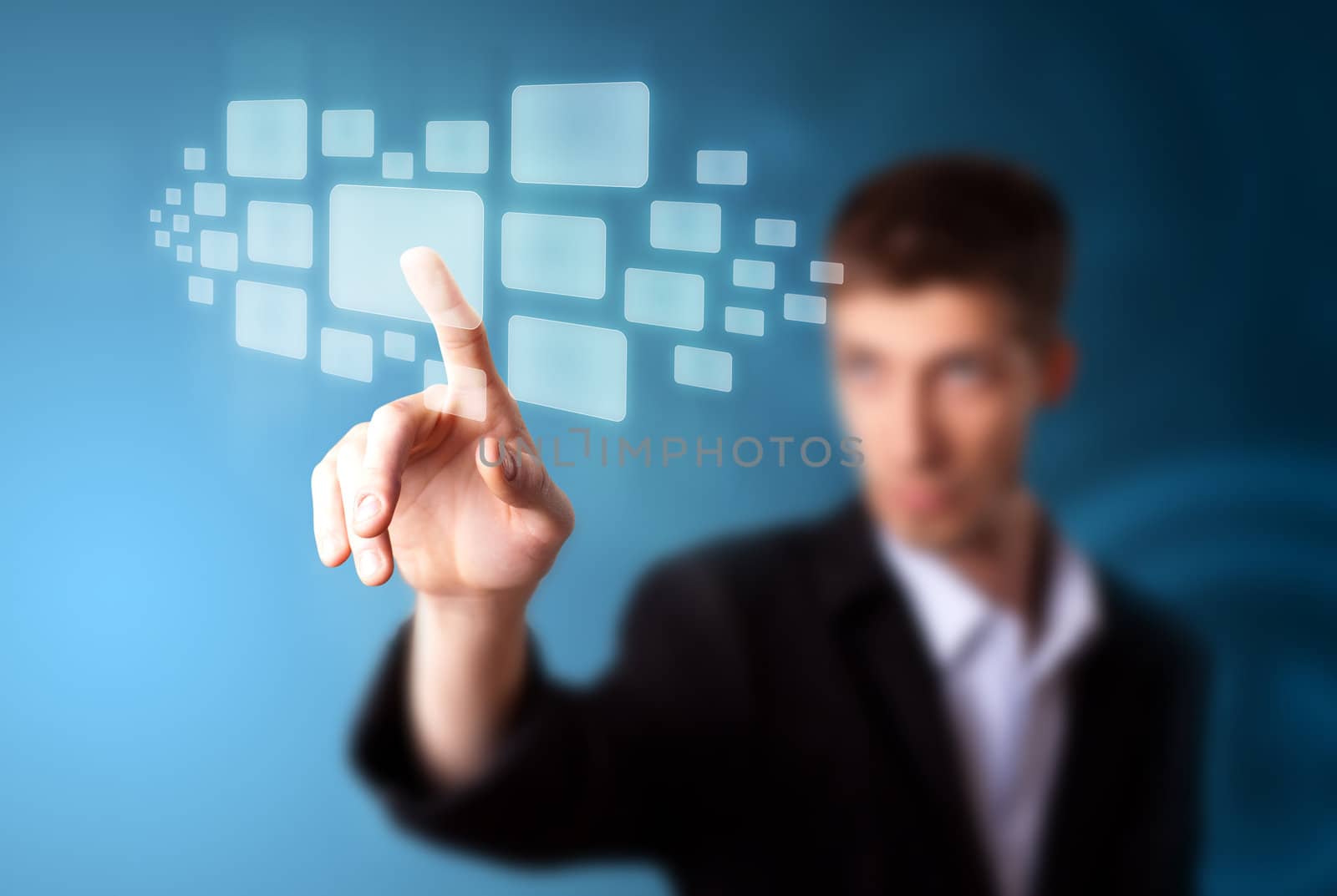 Businessman pressing high tech type of modern buttons on a virtual background