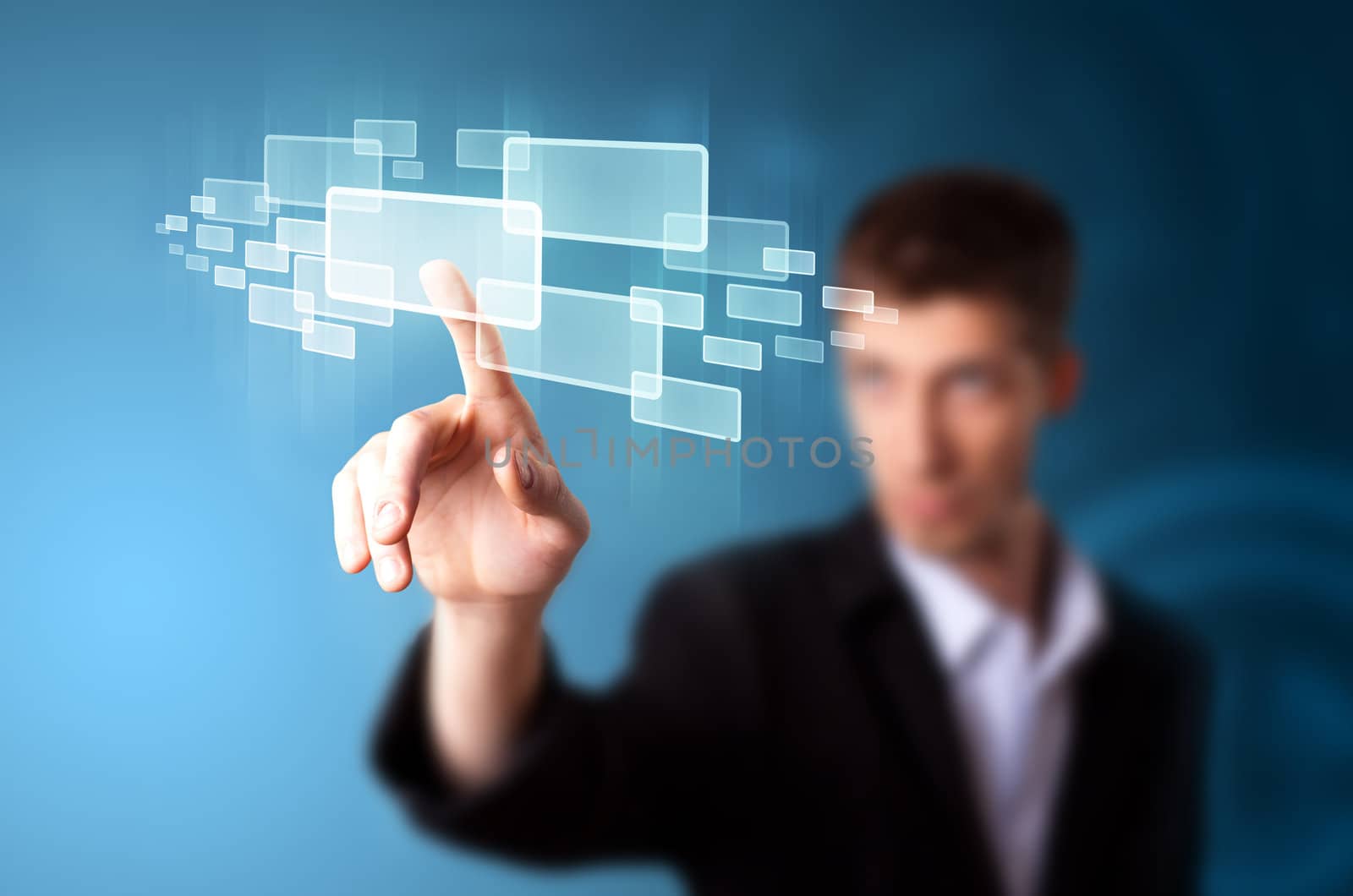 Businessman pressing high tech type of modern buttons on a virtual background