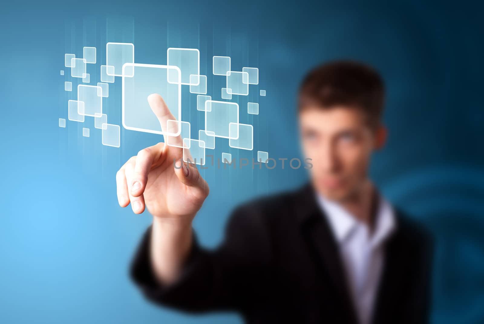Businessman pressing high tech type of modern buttons on a virtual background