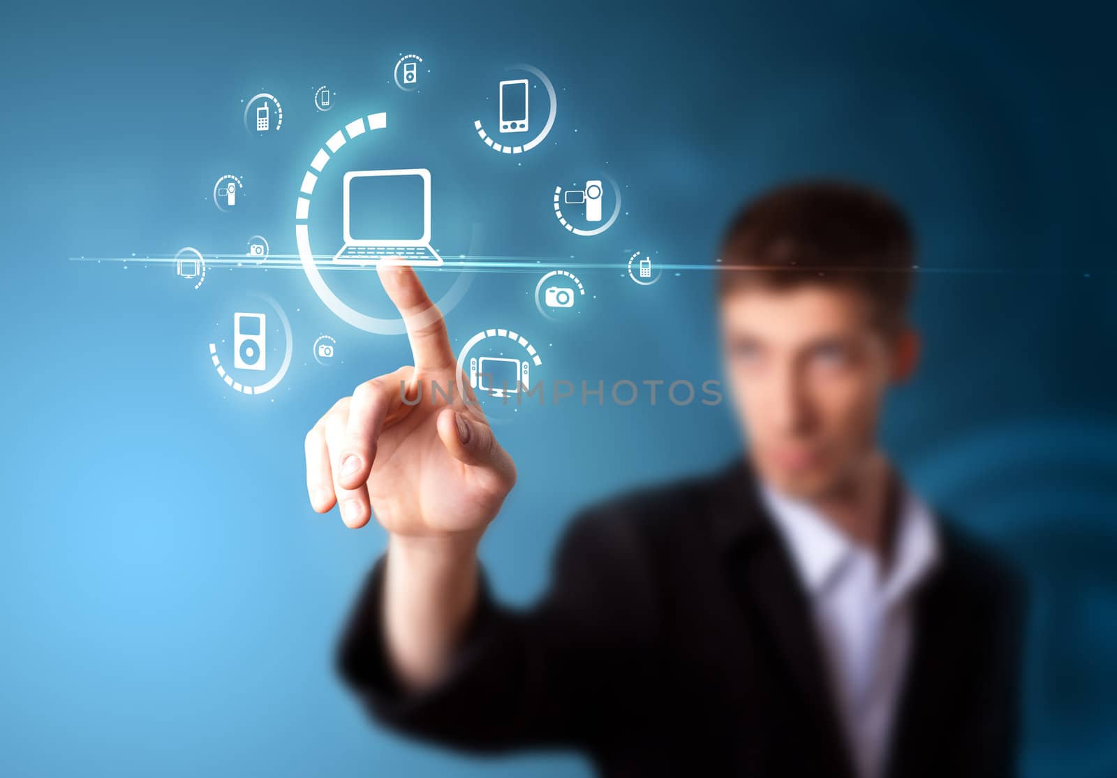 Businessman pressing multimedia type of modern buttons with virtual background