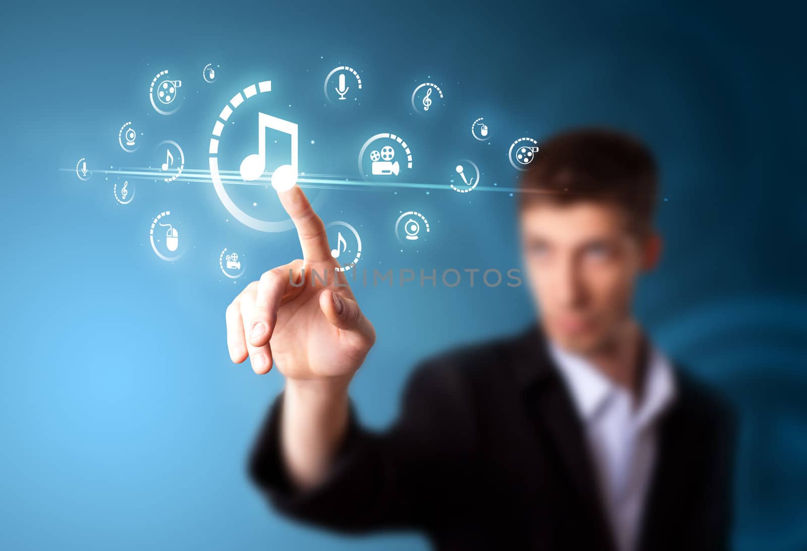 Businessman pressing multimedia type of modern buttons with virtual background